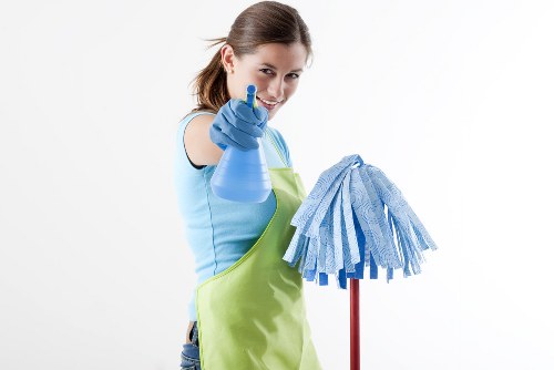 Carpet cleaning professional preparing equipment safely for a property cleaning task