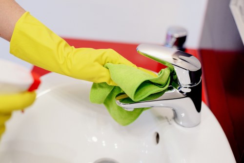 Local sofa cleaning technician treating stains on a lounge suite