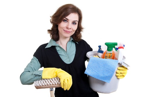 Trained carpet cleaner using protective gear during service